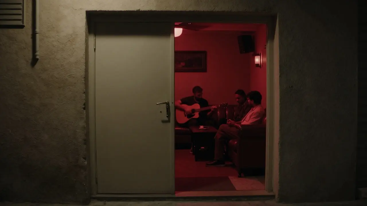 A hidden underground lounge in Al Quoz with dim lighting, leather couches, and a live acoustic musician playing for a small group.